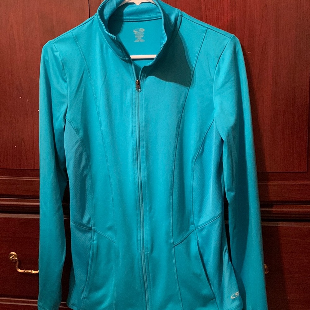 Beautiful aqua colored workout jacket.